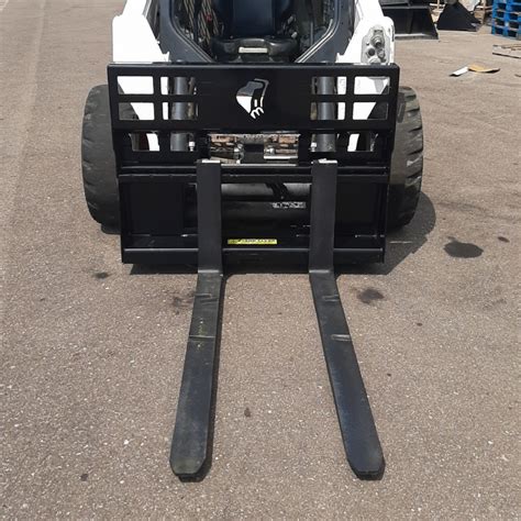 how much can a skid steer lift with forks|universal skid steer forks.